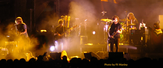 My Morning Jacket play a dazzling 3 hr set in a late night rain storm at Bonnaroo 2008.